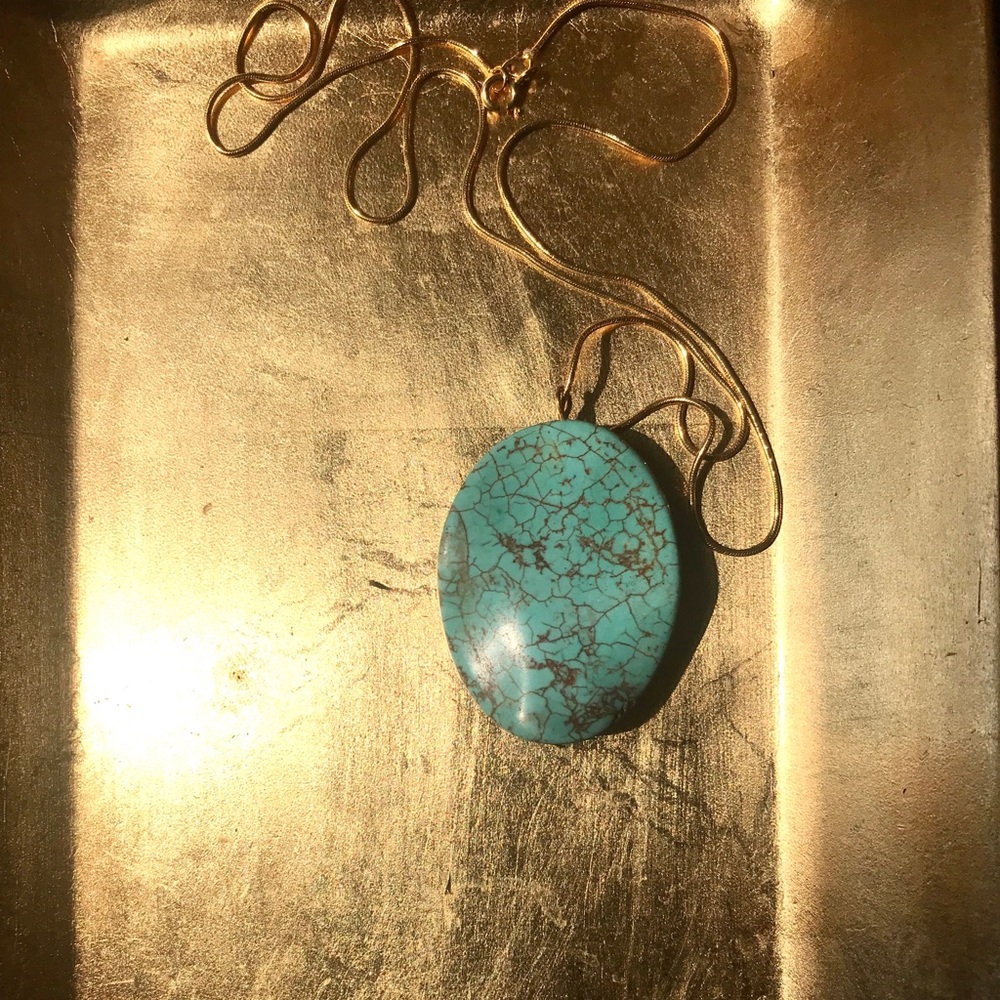 Turquoise pendant with a 20’’ 14k gold chain.